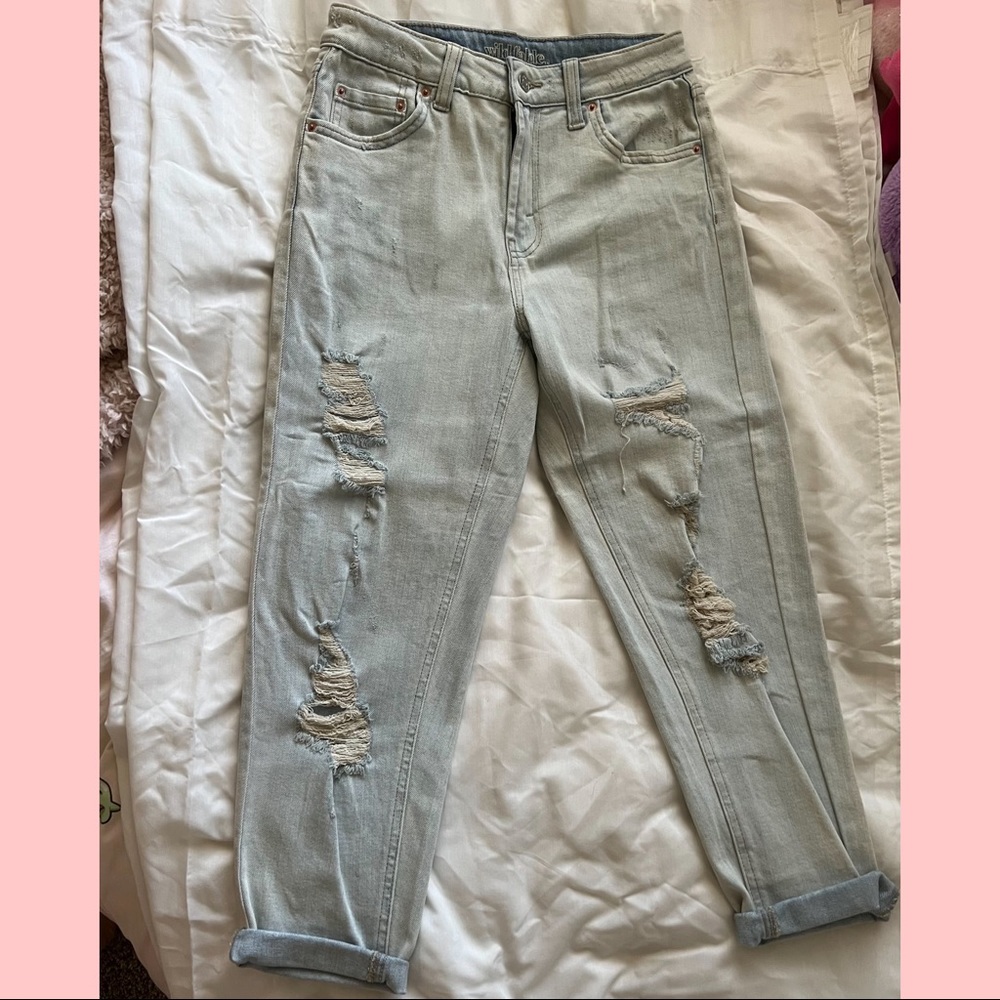 Ripped slightly baggy light denim jeans
